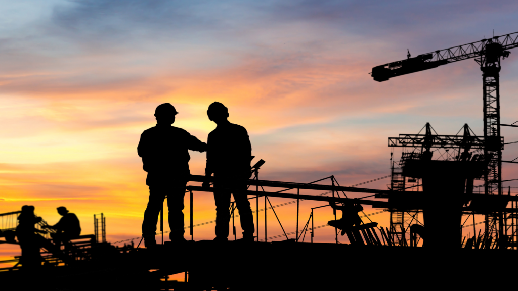 Construction workers looking at a construction site