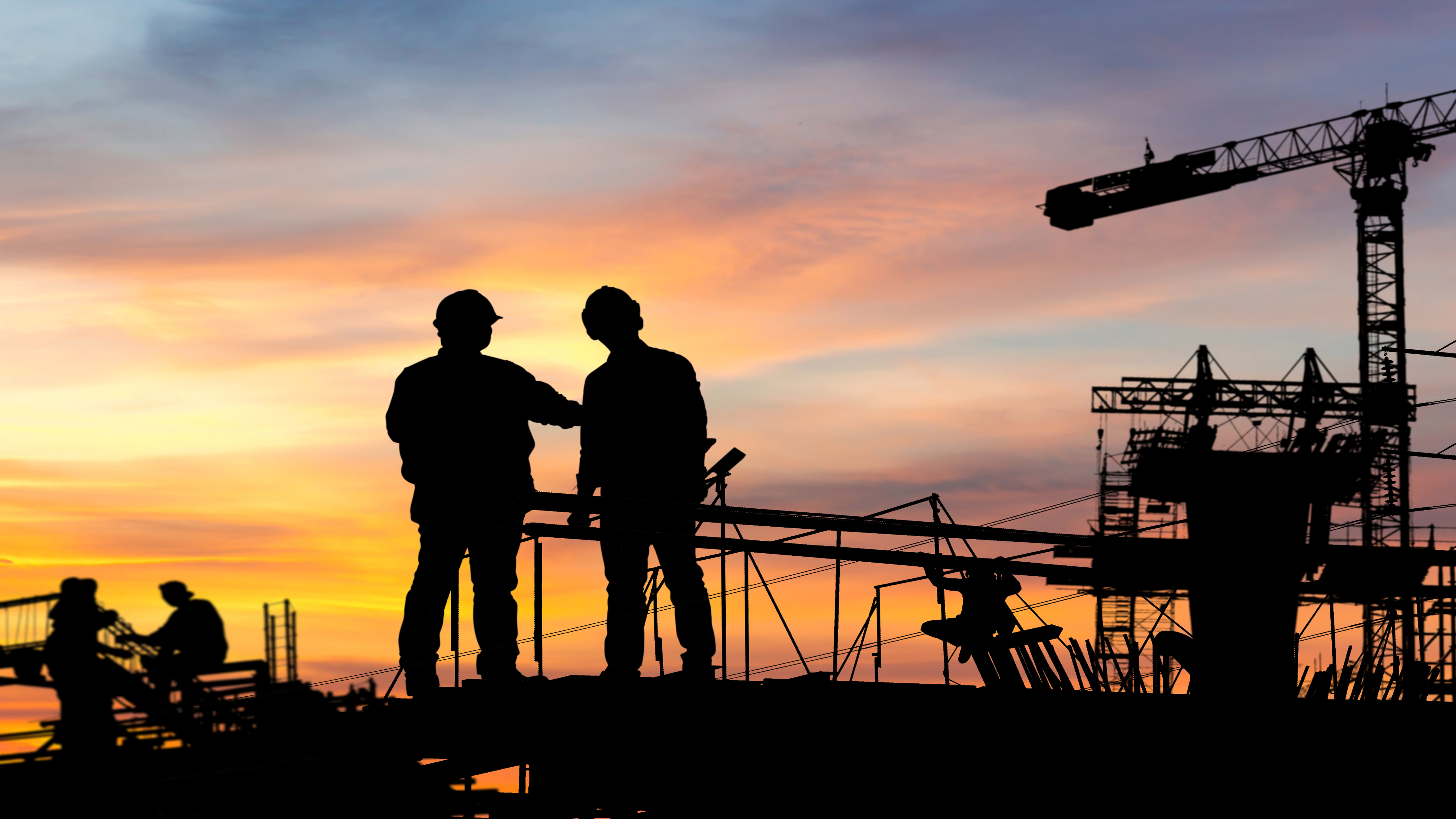 Construction workers looking at a construction site